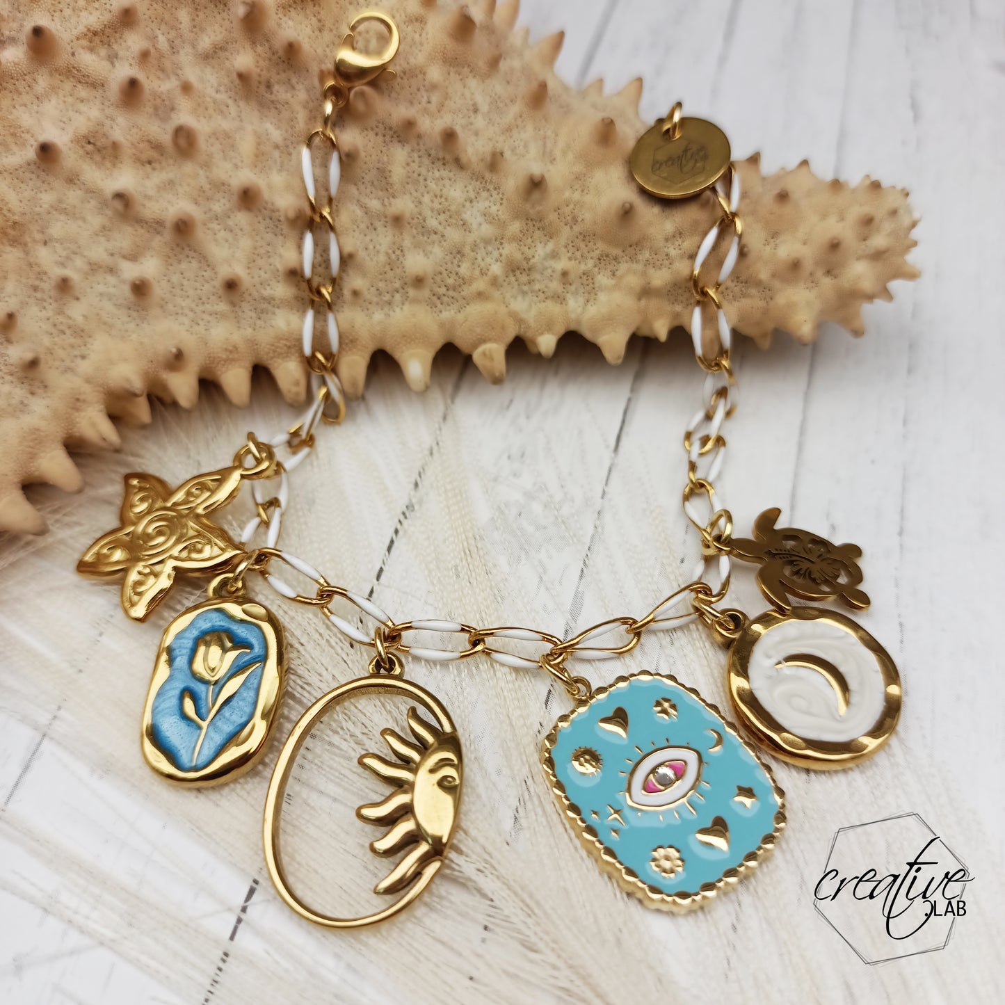 Bracciale in acciaio oro con ciondoli