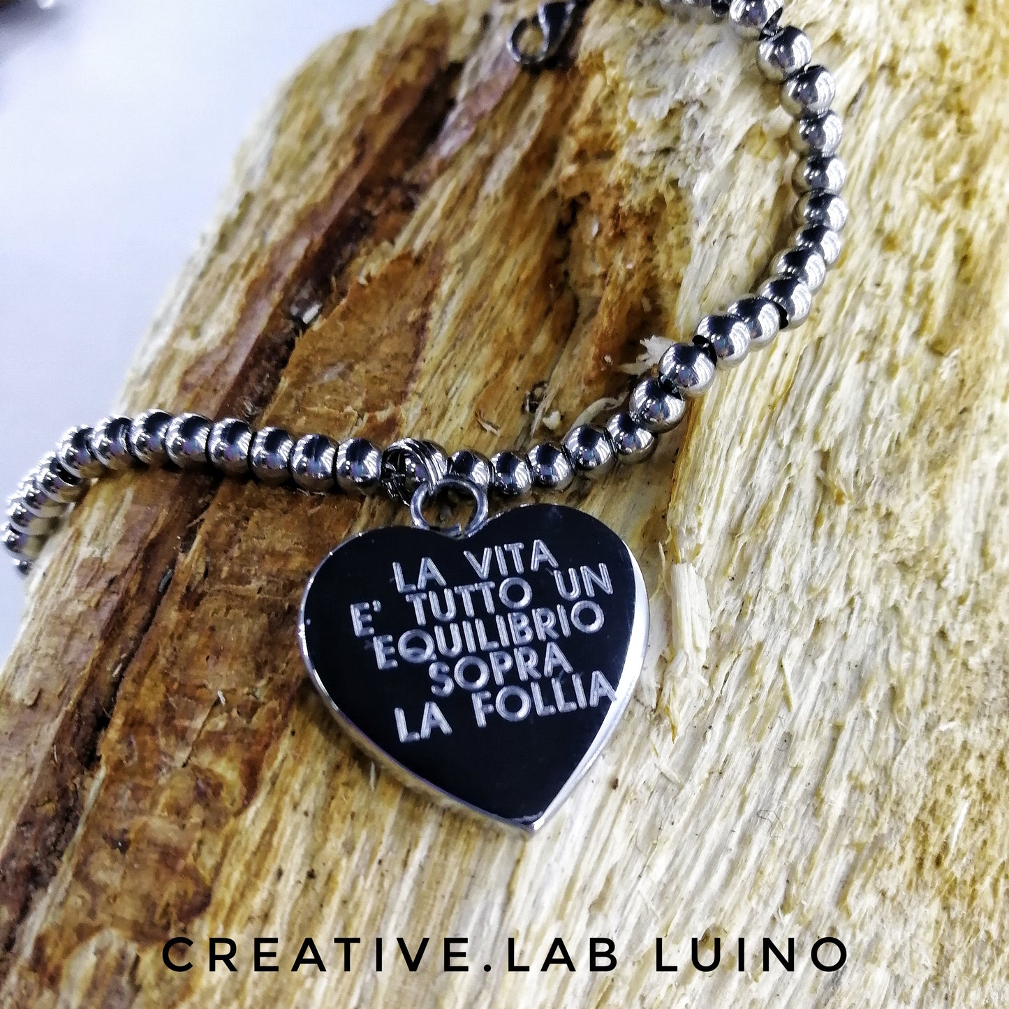 Bracciale a palline in acciaio con ciondolo a cuore (G44+A11)
