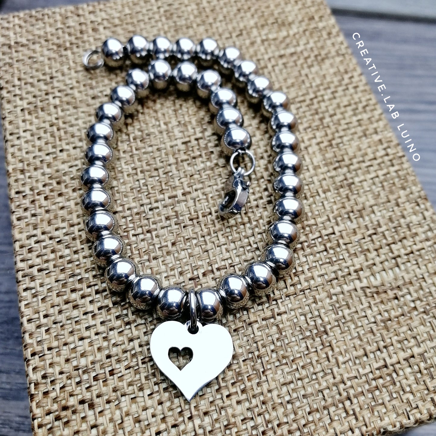 Bracciale a palline in acciaio regolabile con ciondolo a cuore (G44+A25_1)