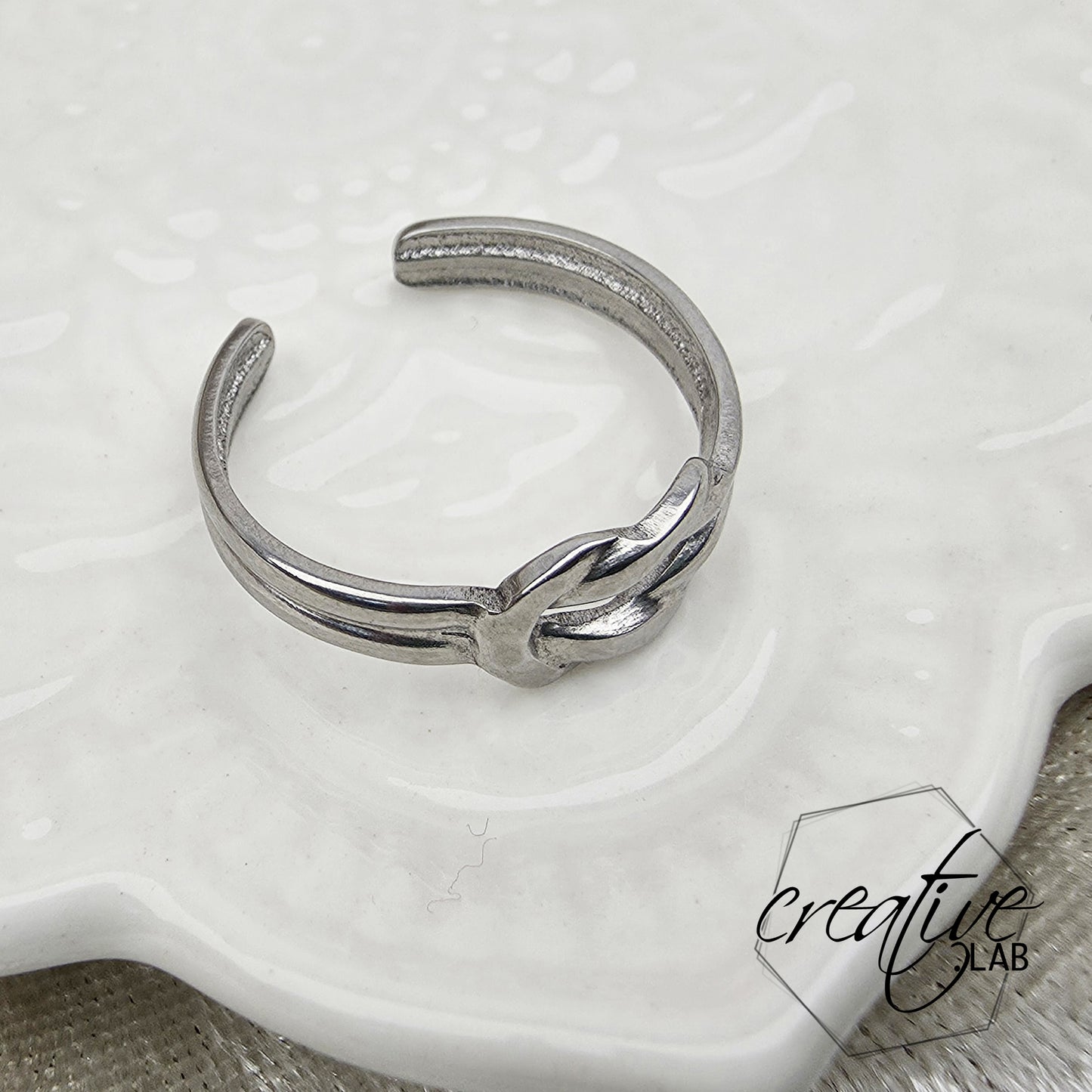 Anello in acciaio Doppio Nodo