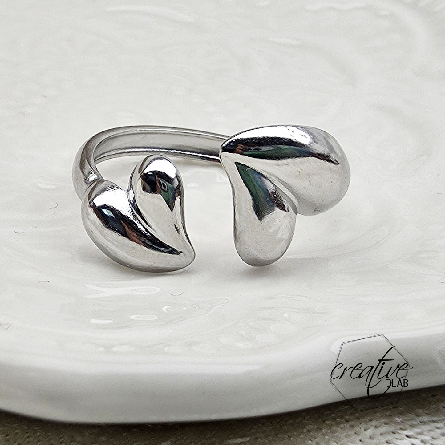 Anello in acciaio Foglie a Cuore