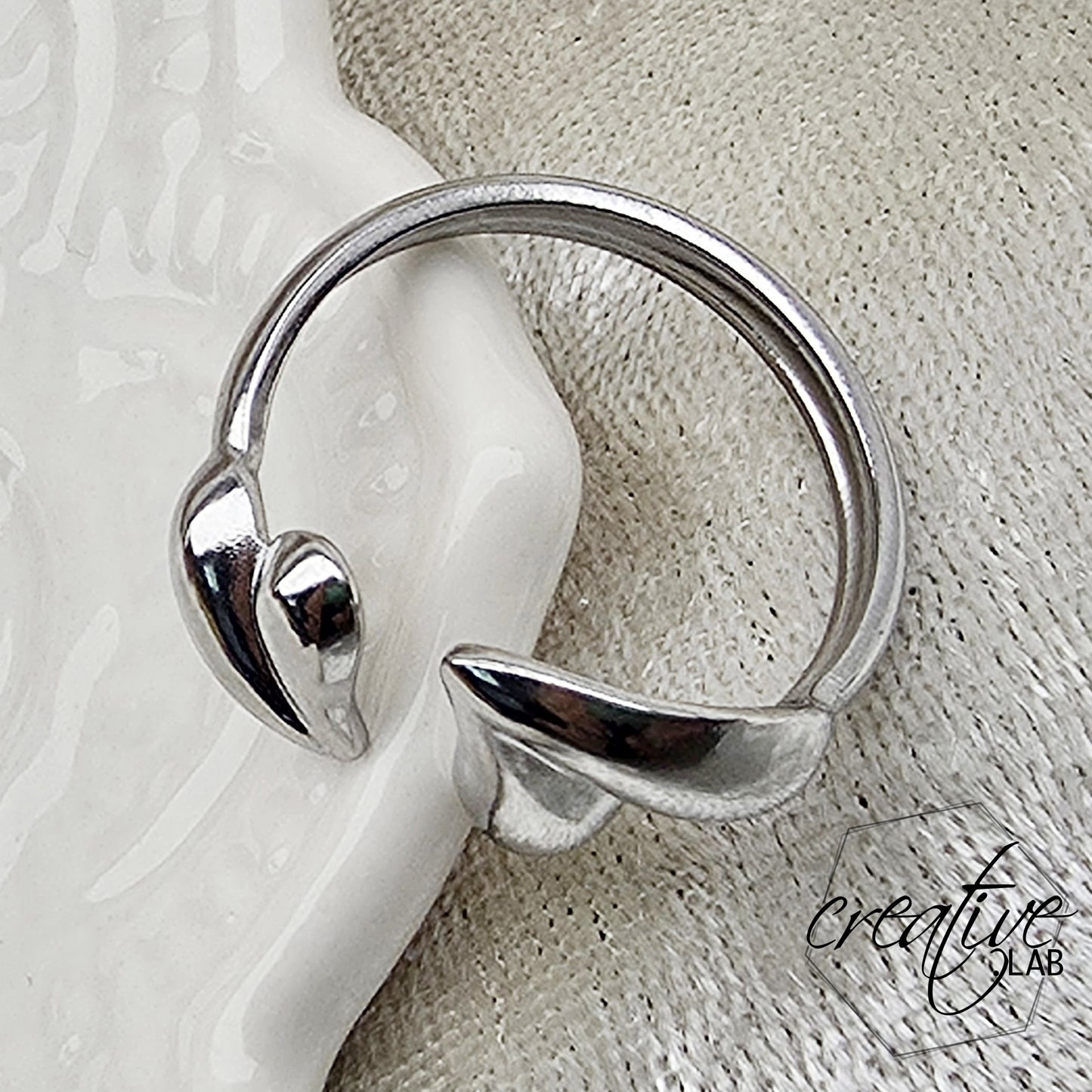 Anello in acciaio Foglie a Cuore