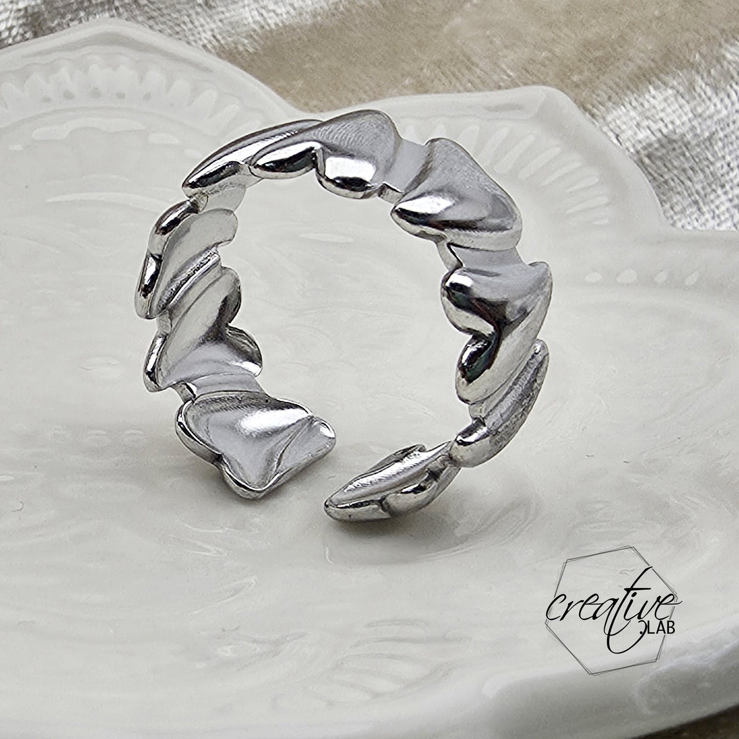 Anello in acciaio Cuori Pieni