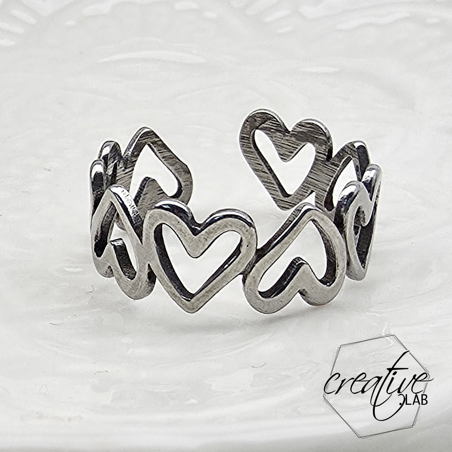 Anello in acciaio Cuori Vuoti