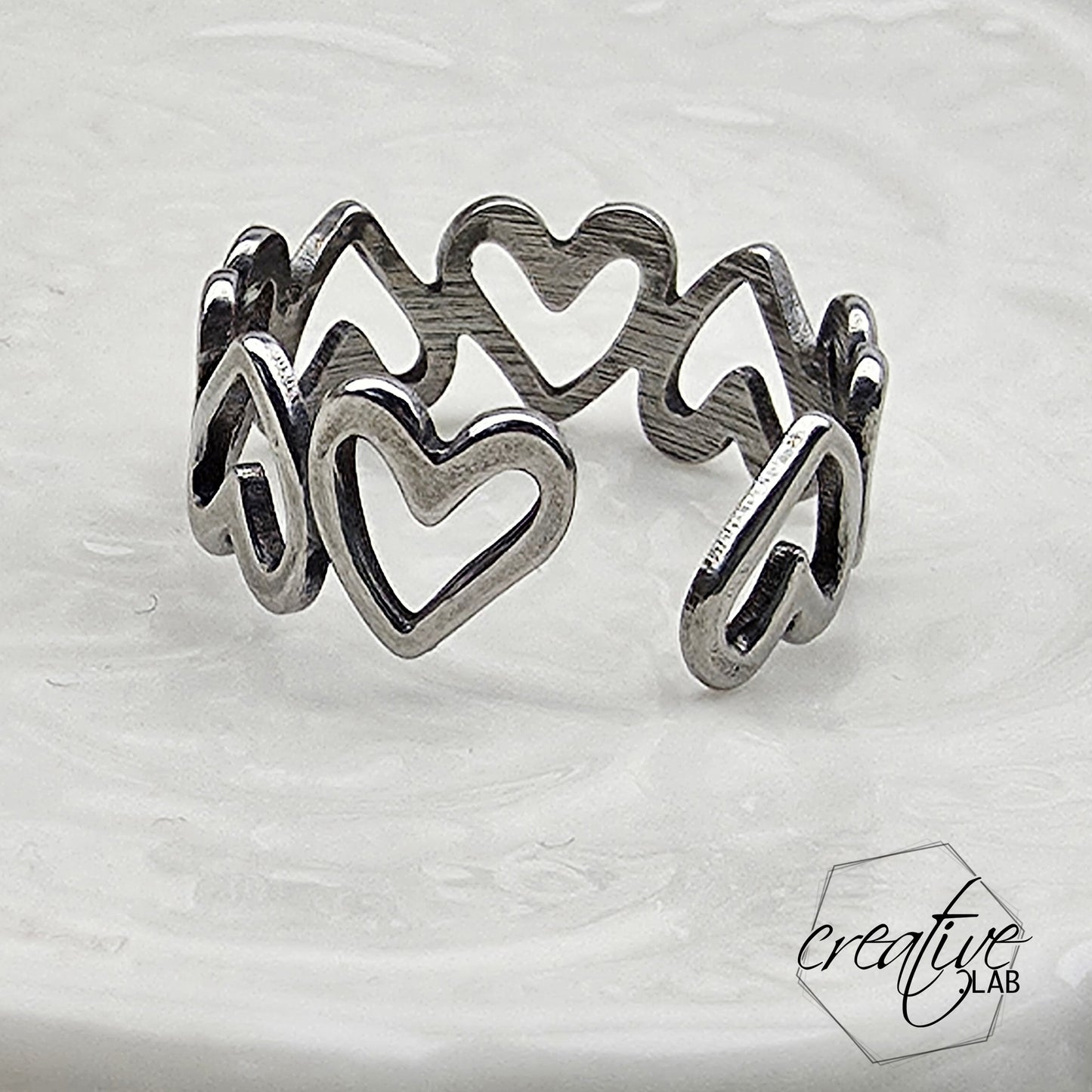 Anello in acciaio Cuori Vuoti