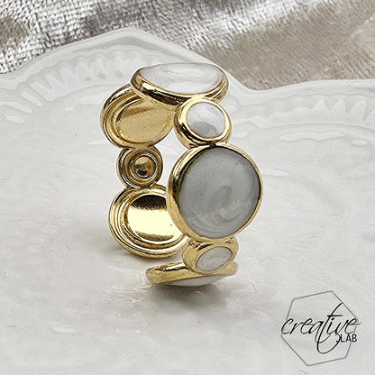 Anello in acciaio oro Bolle smaltate bianche