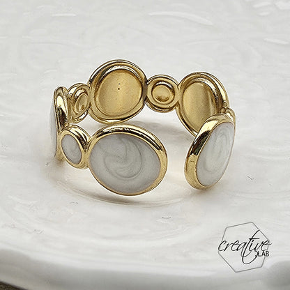 Anello in acciaio oro Bolle smaltate bianche