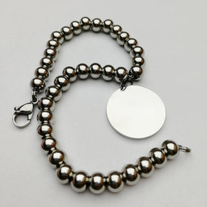 Bracciale con perle in acciaio e ciondolo tondo (G44+B11)