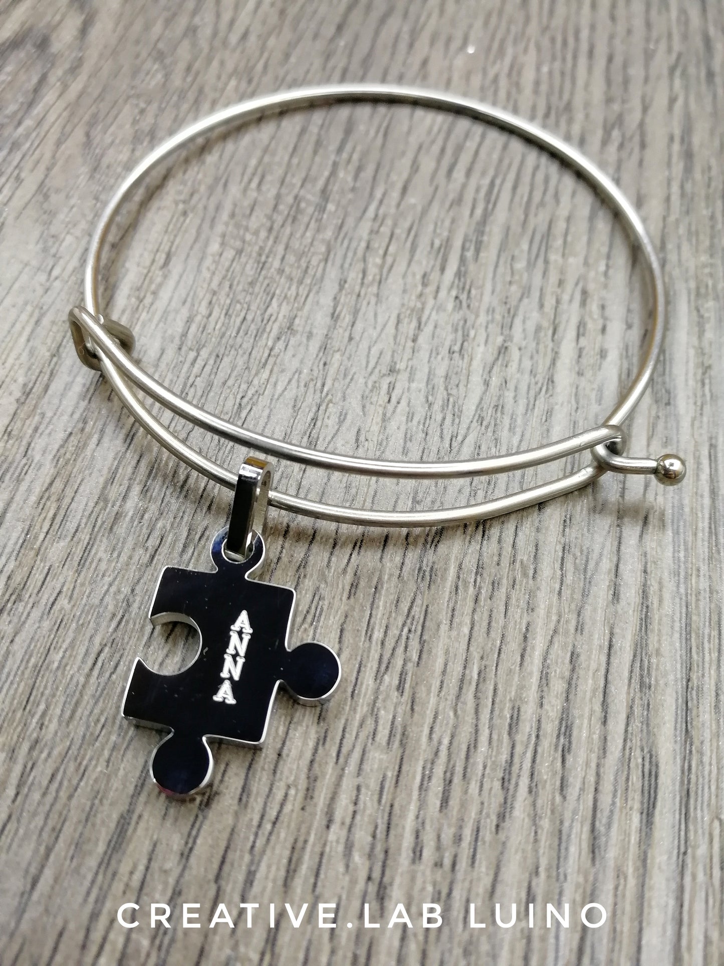 Coppia di bracciali rigidi e ciondoli personalizzabili a puzzle (G14+A7)