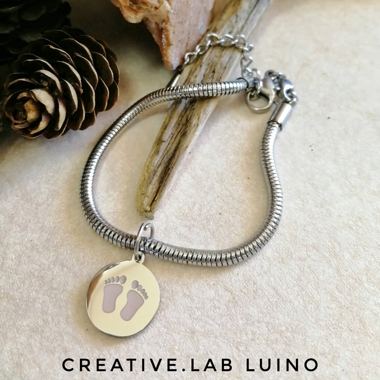 Bracciale snake in acciaio con ciondolo con piedini rosa/azzurri (G4+B33)