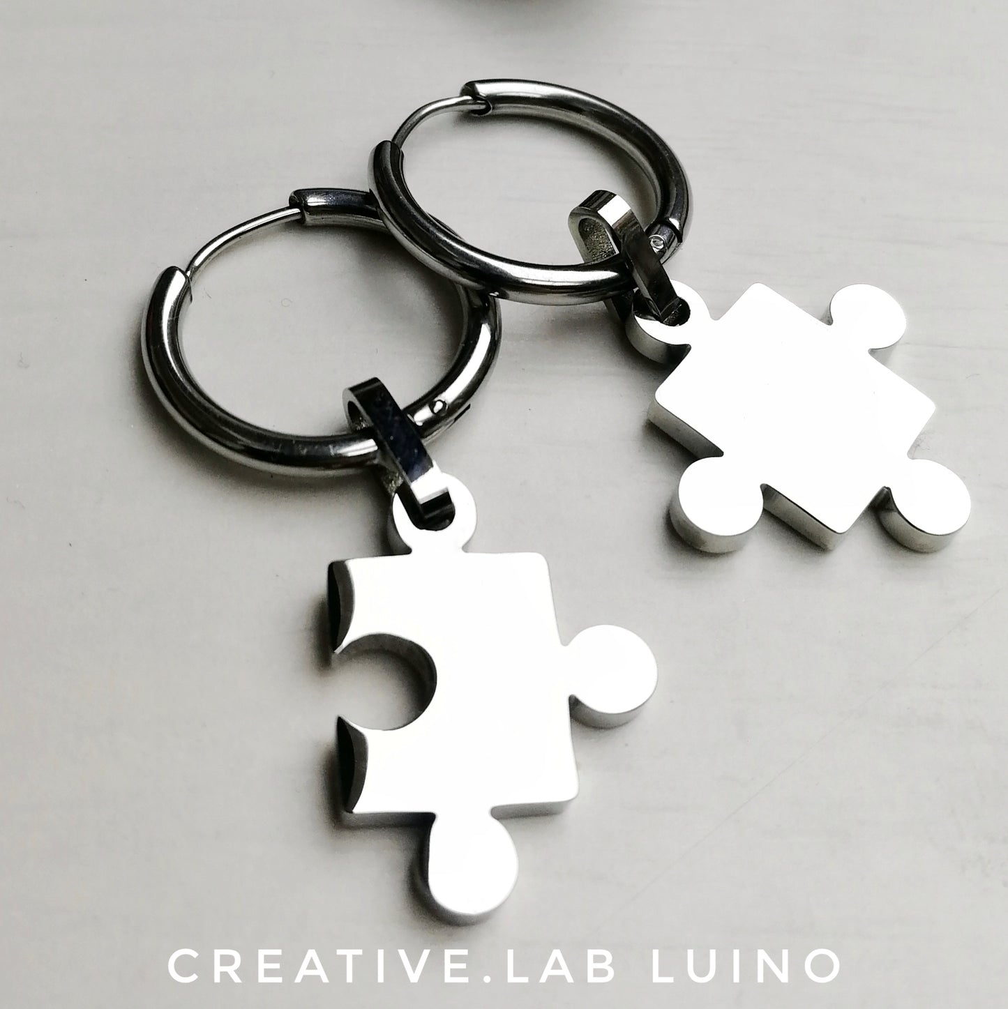 Orecchini a cerchio 22 mm con puzzle (A7)