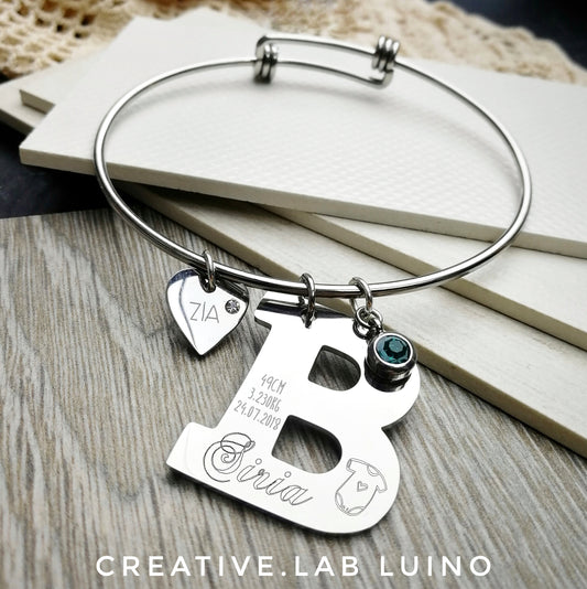 Bracciale certificato di nascita con iniziale personalizzabile e cuore (G16+lett+A3B cert.nasc)