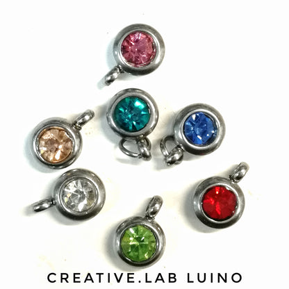Bracciale con stelline, sagome di bimbo/a, strass e iniziale (M17B+A23/A24+iniz+strass)